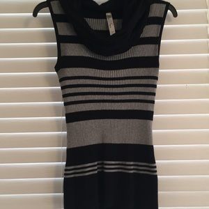 Sleeveless cowl neck sweater.